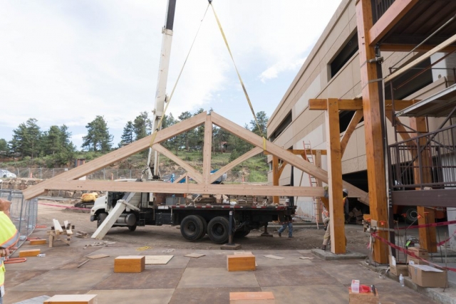 Install of the timber frame porte cochere in Estes Park