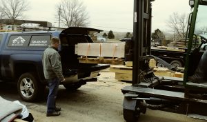 Customer getting white oak stair treads loaded in his truck.